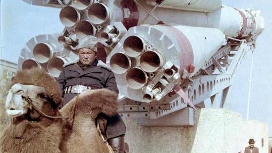 Man on camels at the Baikonur Cosmodrome.jpeg